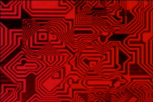 Still from 'Pixillation' by Lillian Schwartz depicting interlocking geometric patterns in red and black.