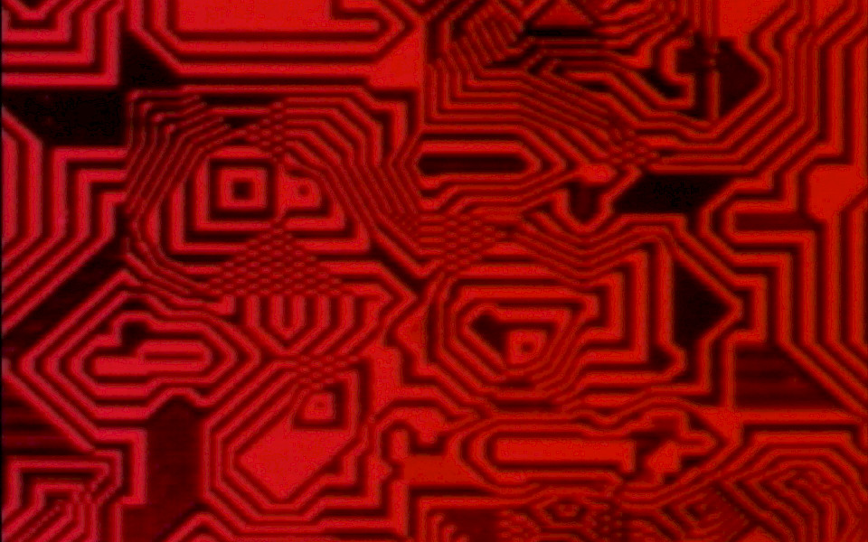 Still from 'Pixillation' by Lillian Schwartz depicting interlocking geometric patterns in red and black.