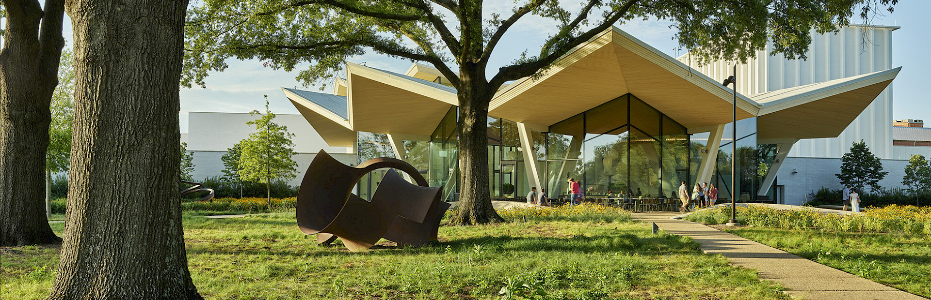 Photo of the Park Entrance to AMFA with a large metal outdoor sculpture in the foreground.