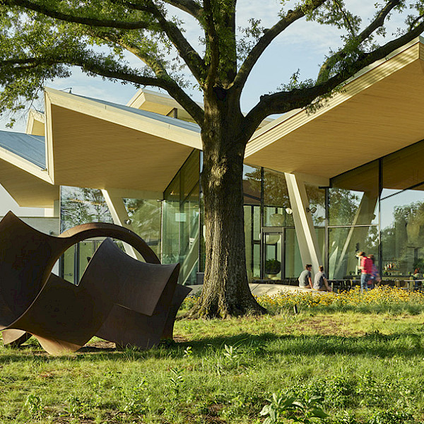 Photo of the Park Entrance to AMFA with a large metal outdoor sculpture in the foreground.