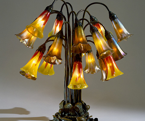 Tiffany Glass and Decorating Company (1892 - 1900), "Eighteen-Light Pond Lily Lamp," circa 1900, blown glass and bronze, 20 1/4 x 18 in., On loan from the Chrysler Museum of Art, Gift of Walter P. Chrysler, Jr. 0.2391. Image courtesy of the Chrysler Museum of Art. Photography by Edward Pollard, © Tiffany Studios.